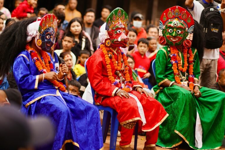 A vibrant masked dance performance at a cultural festival in Kathmandu, Nepal.
